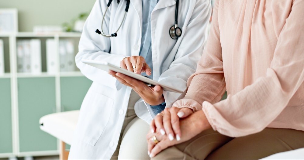 woman talking to doctor.