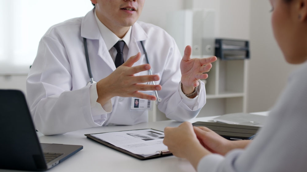 woman talking to male doctor.